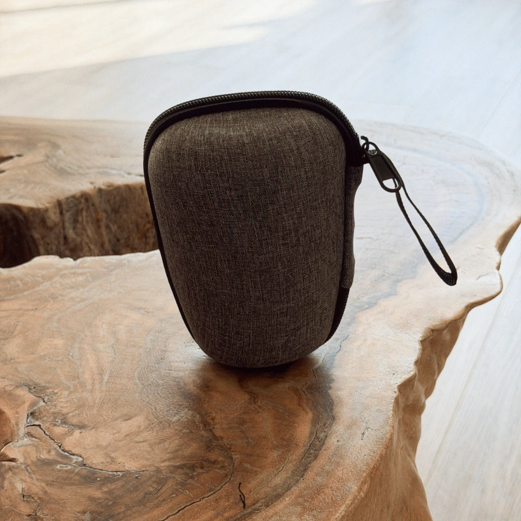 dark grey travel case for gaiwan tea ceremony set on natural live edge wood