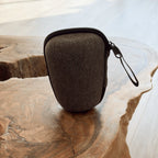 dark grey travel case for gaiwan tea ceremony set on natural live edge wood