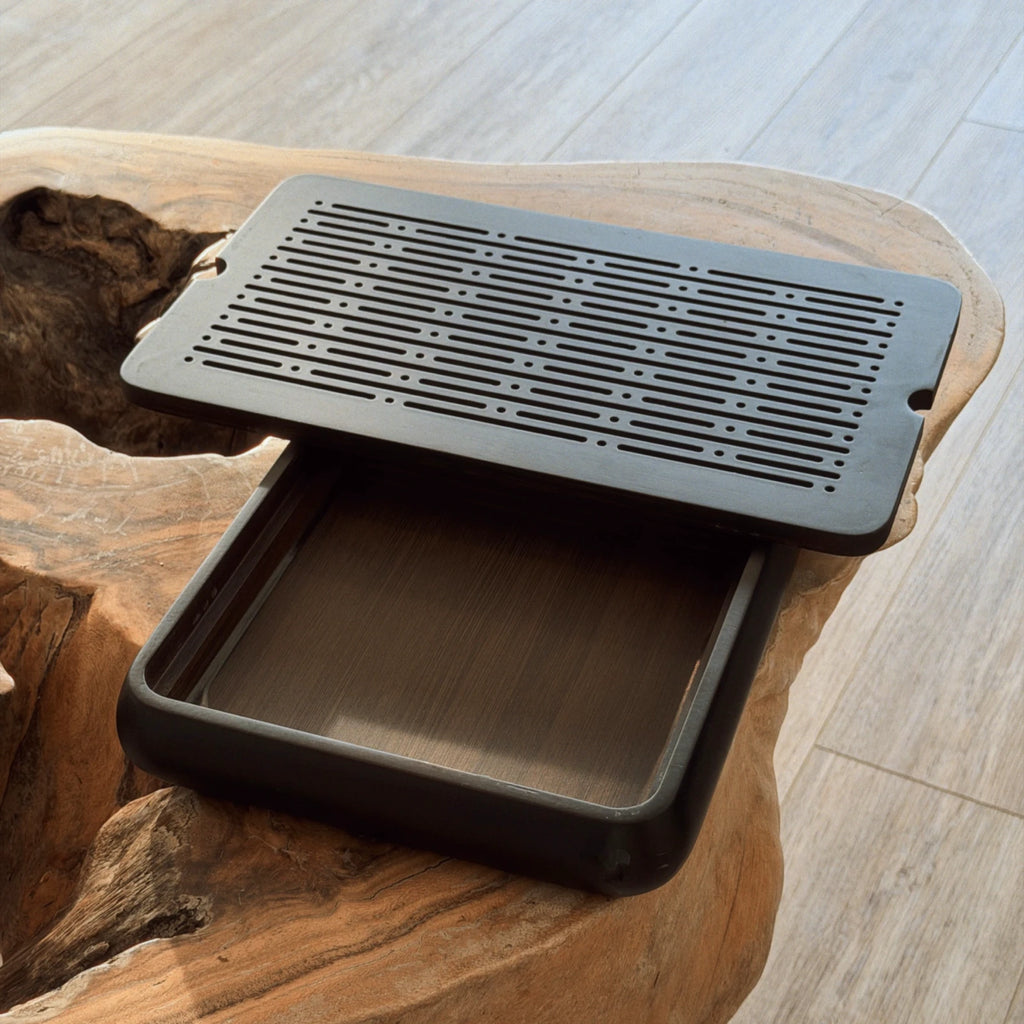 Small black tea tray chaban top view showing drainage grid pattern