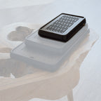 Small black tea tray chaban on light stone surface minimalist style